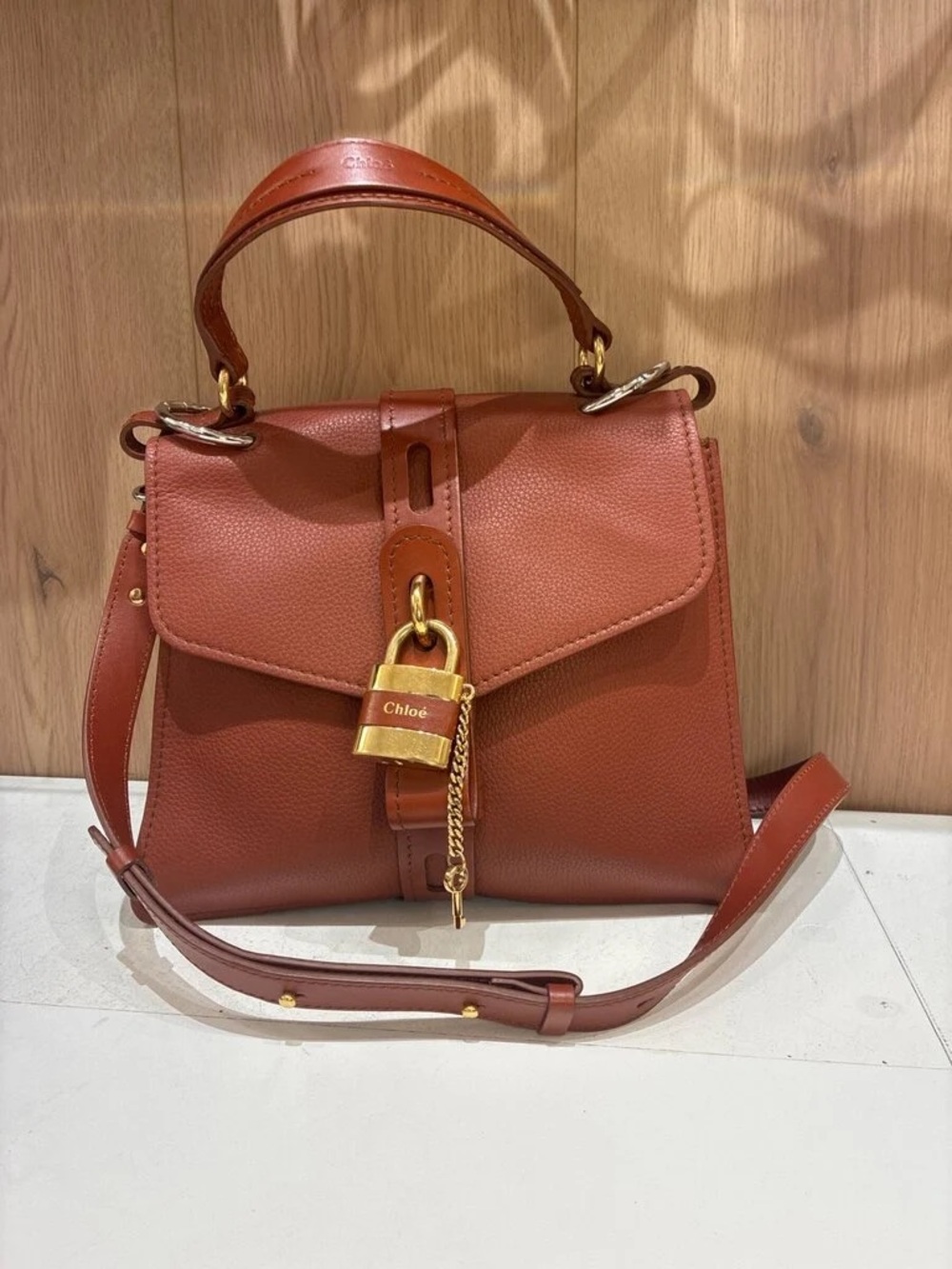 Brown Leather Top-Handle Satchel with Gold Padlock